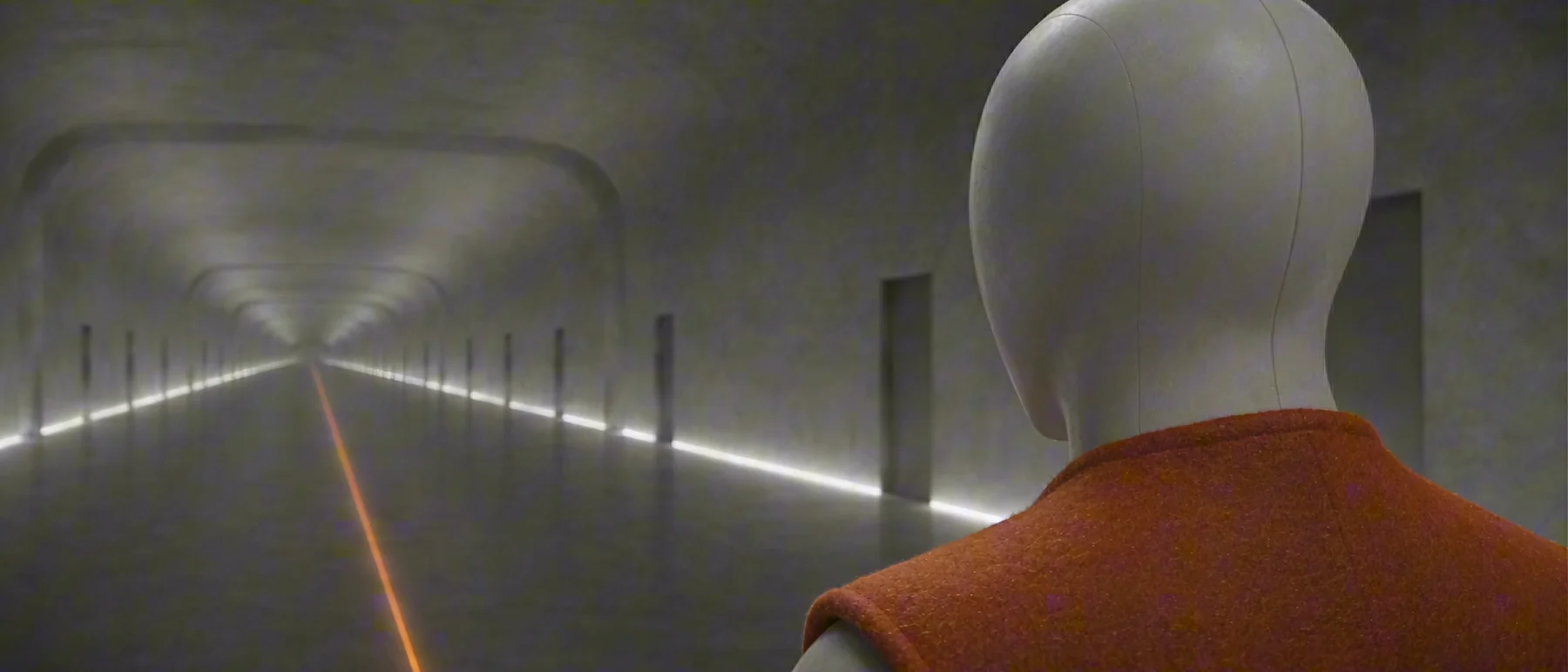 The companion in a long illuminated corridor.